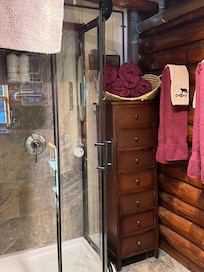 Standup shower stall with hot showers. Toilet has a heated seat!