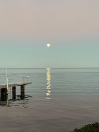 Moon setting past the dock