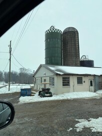 Barn next to their home with dairy cows