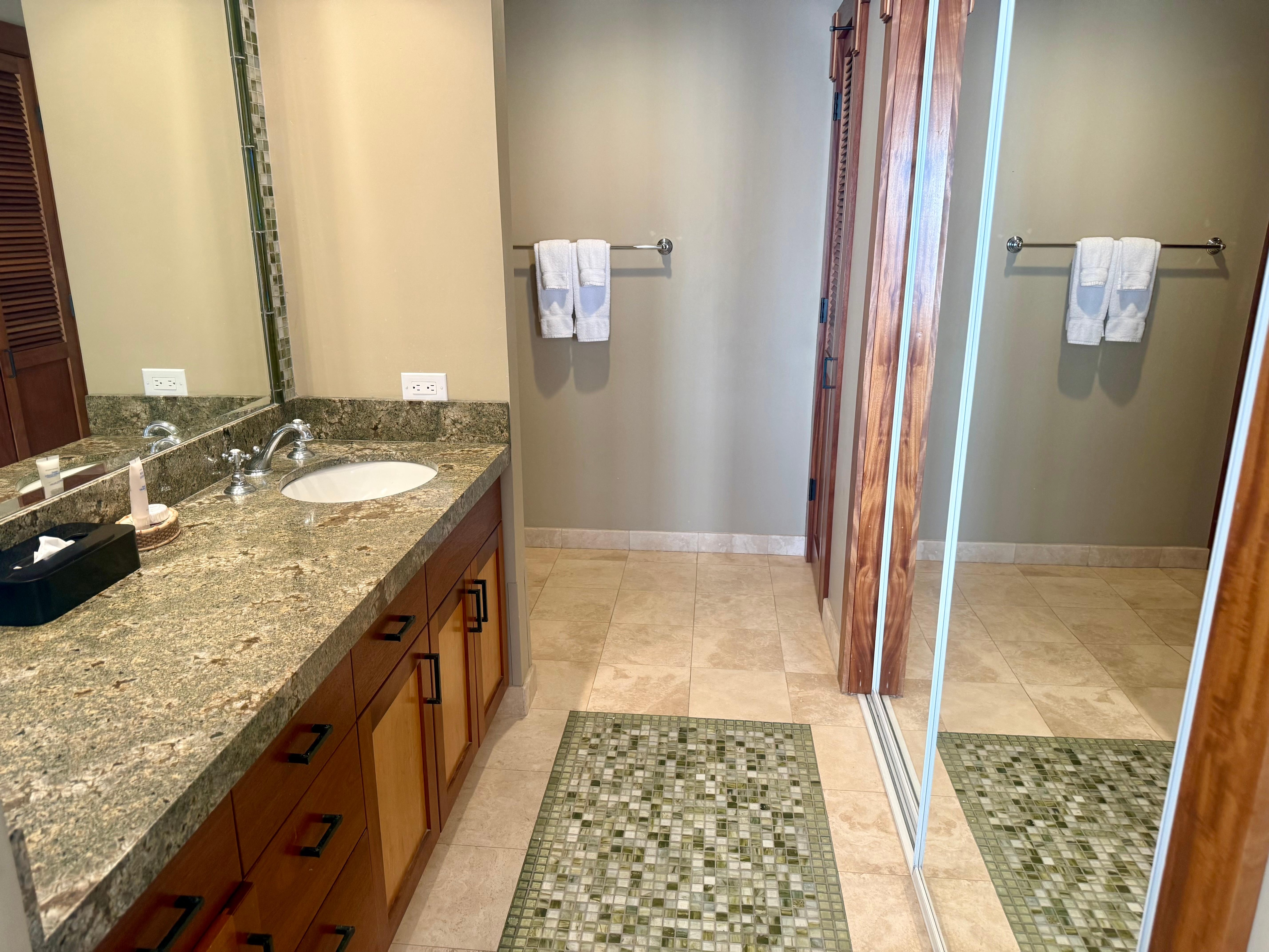 Master bathroom glass shower around the corner