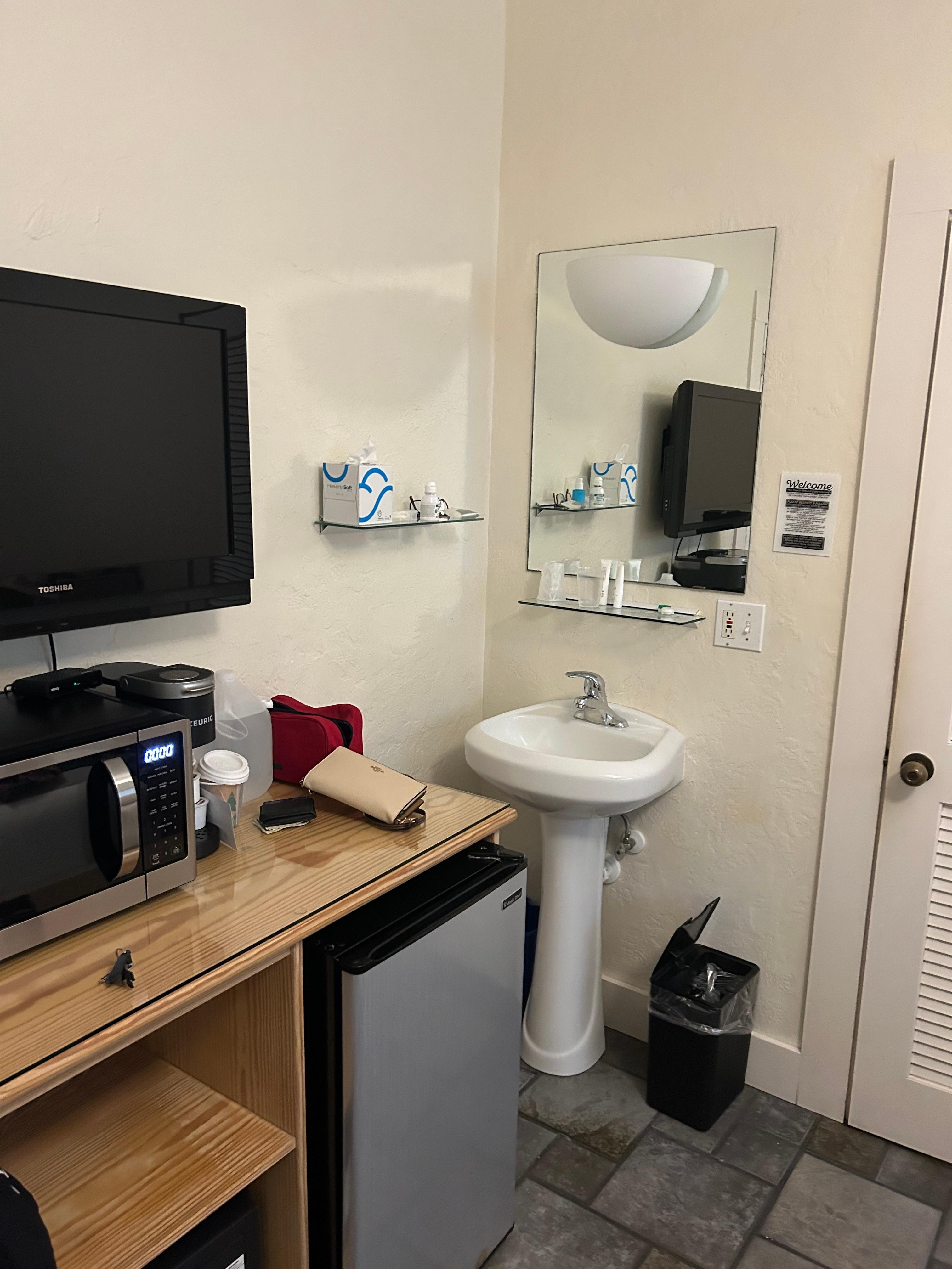 Sink in main room, not a private bathroom. 