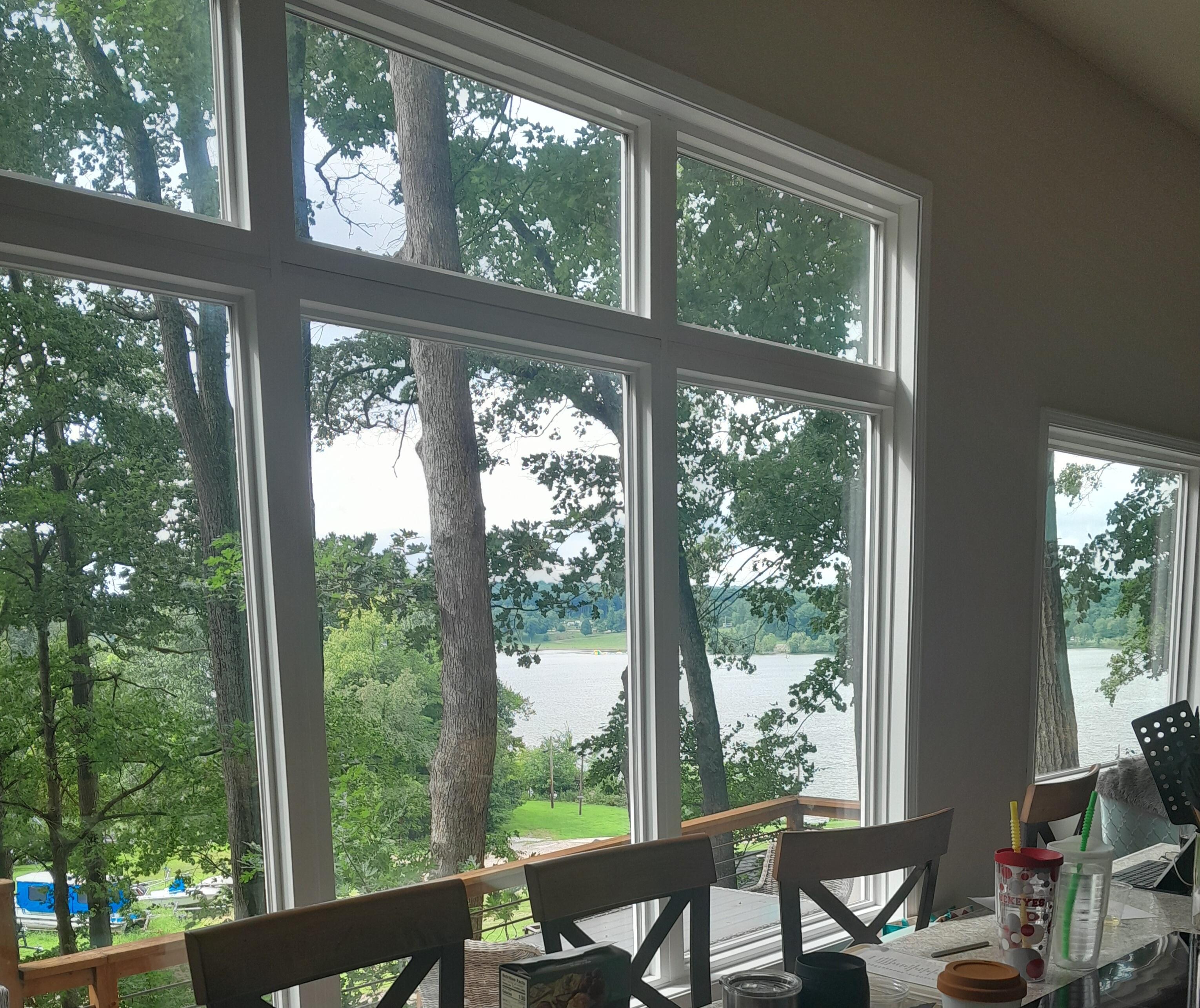 Large windows in living area, with view of lake