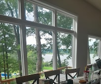Large windows in living area, with view of lake