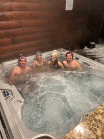 Adults trying out the hot tub