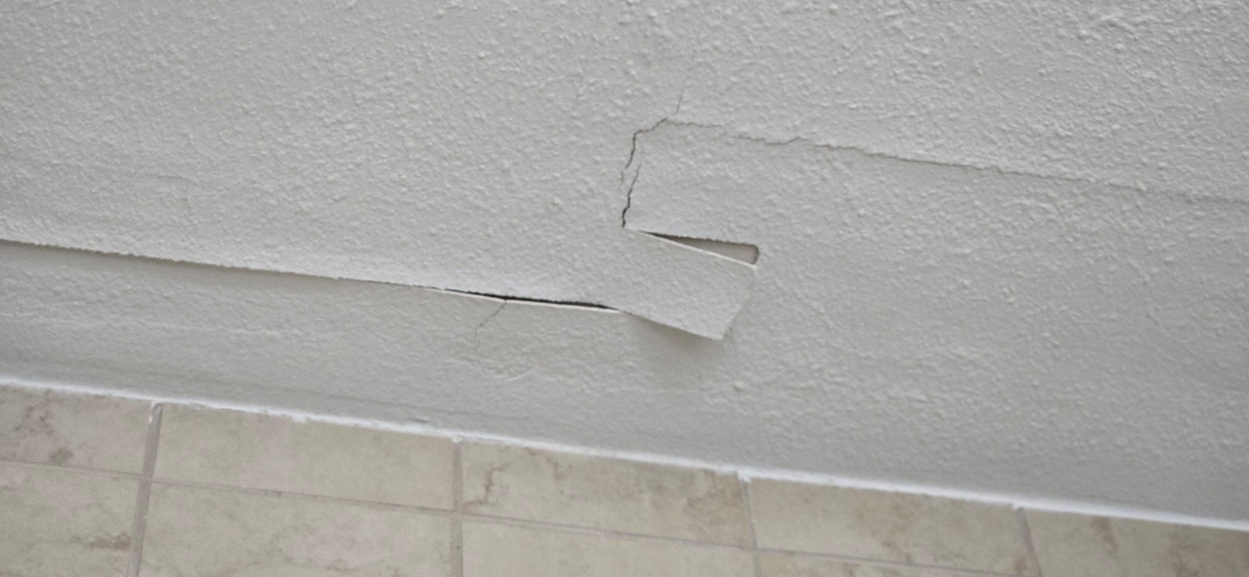 Ceiling paint and tape coming down and peeling