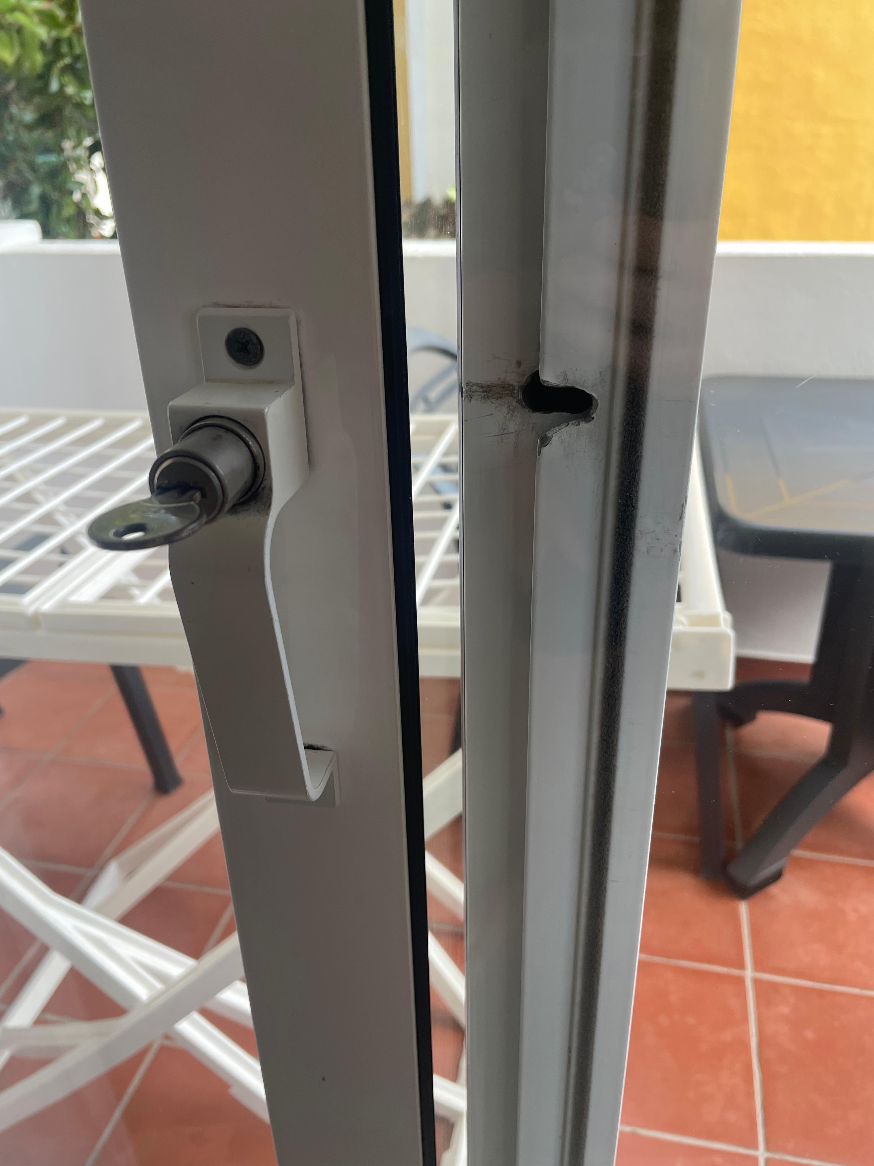 Sliding door on balcony badly damaged from a possible previous forced entry 