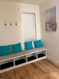 Nice entry area with places for shoes and coats.