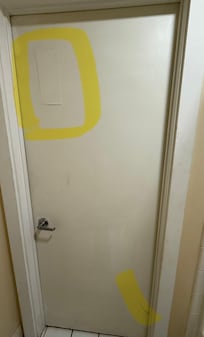 Bathroom door, crappy repair & cracked at base