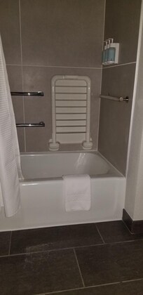 Although I had asked for a room with a shower because I use a walker there were enough safety handles. With some difficulty I was able  to get in/out of the tub - it worked out in the end