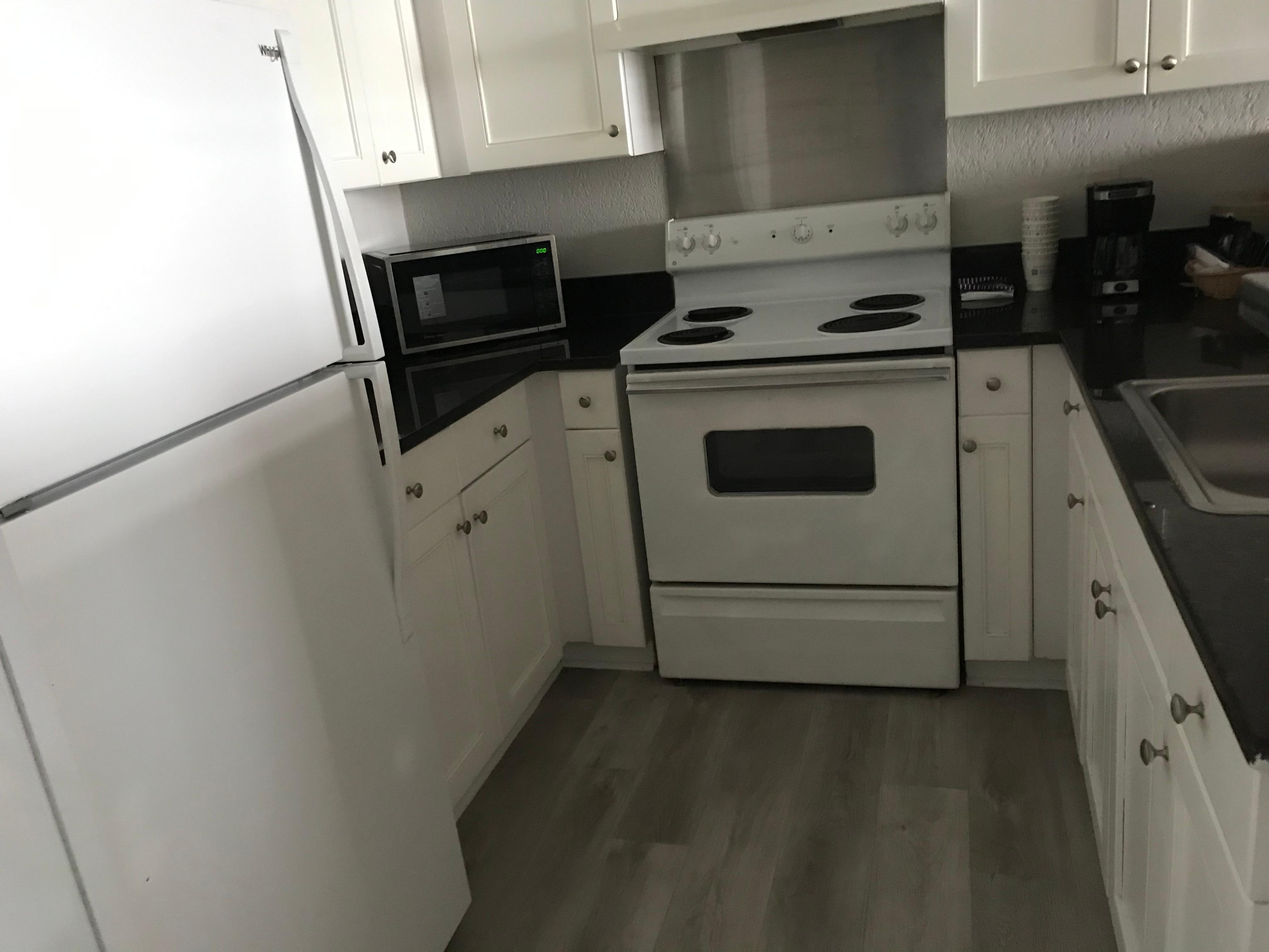 Kitchen had large fridge/freezer combo, stove and oven and microwave and coffee maker.  It could have used more utensils, glasses and coffee cups.  