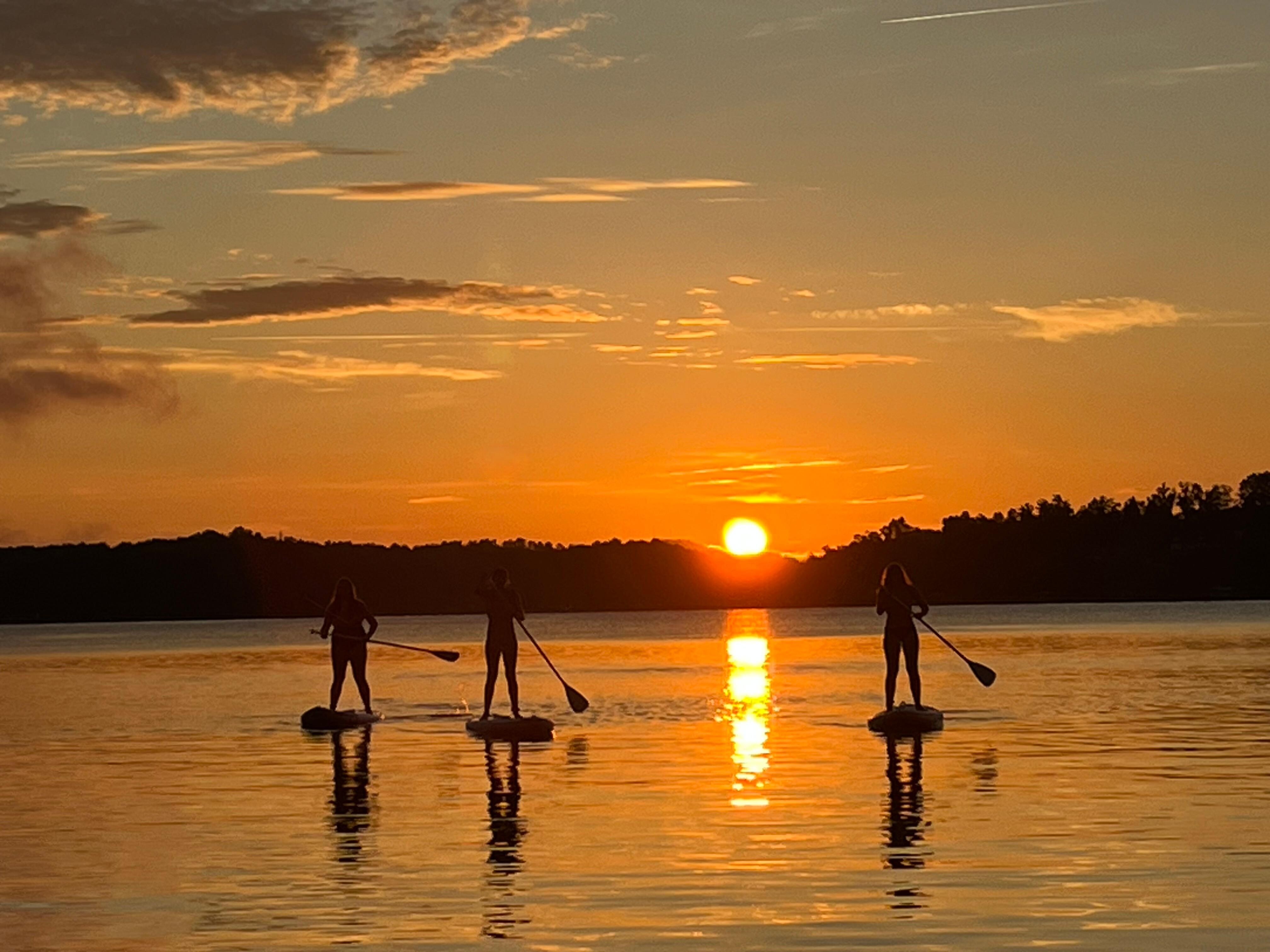 Paddleboarding at sunrise.