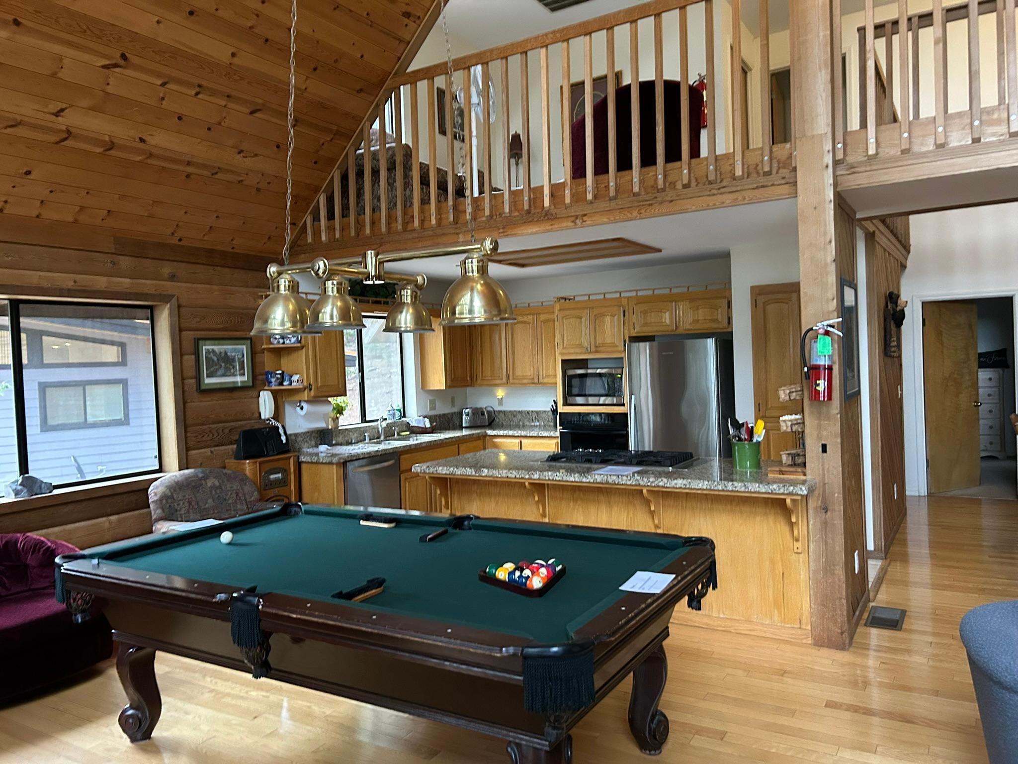 pool table, kitchen and loft