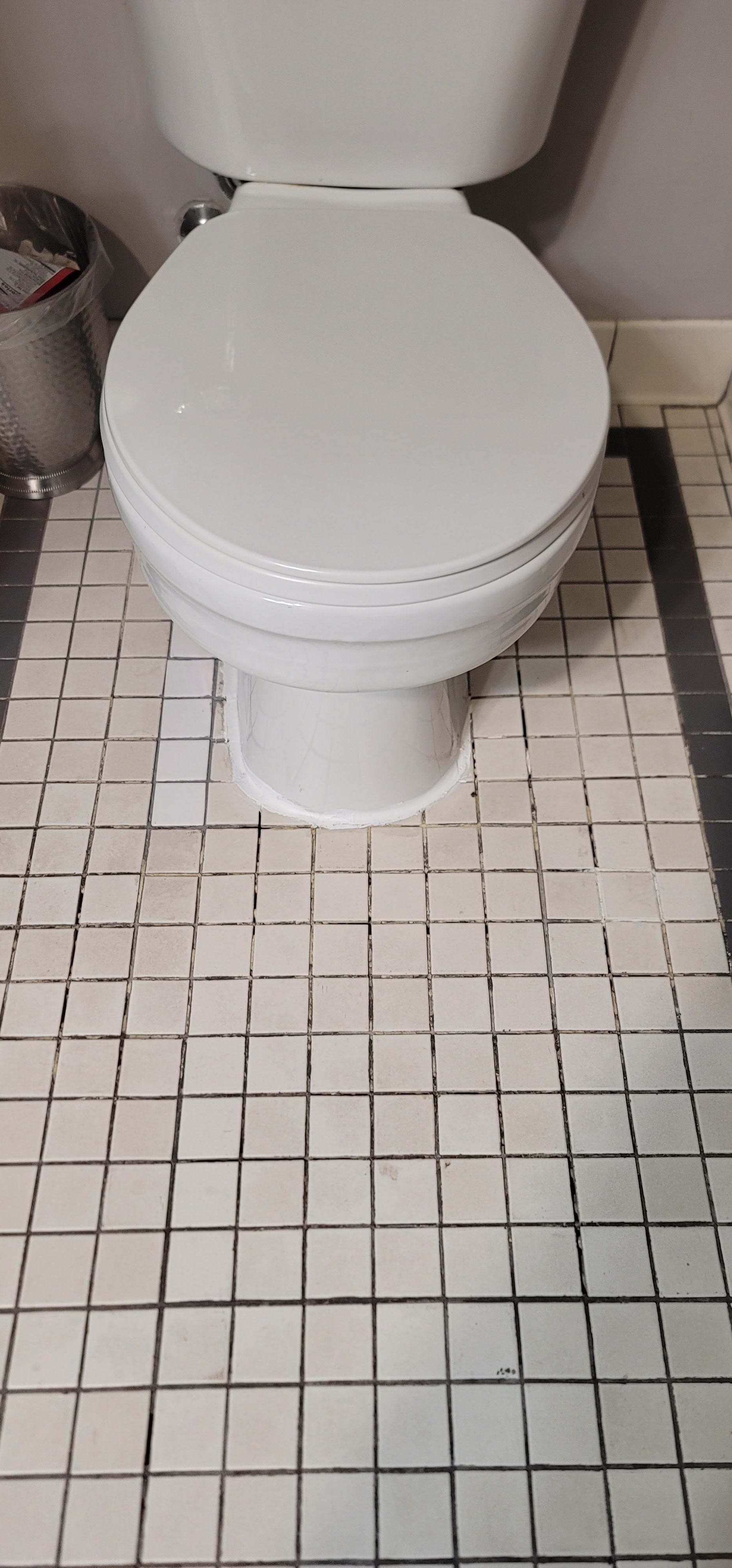 Toilet is sinking in the tile, but it was still clean.