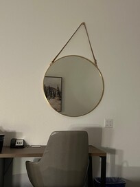 The cricket mirror drove me crazy and couldn’t fix it because it’s secured to the wall not just hanging by that strap.