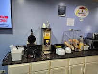 Waffles, that's it. Other ones I've stayed at had scrambled (powdered) eggs, bacon, sausage patties or links, or both, pancakes, and apples, oranges, and bananas.