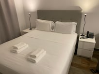 There is a veranda with a little table outside.