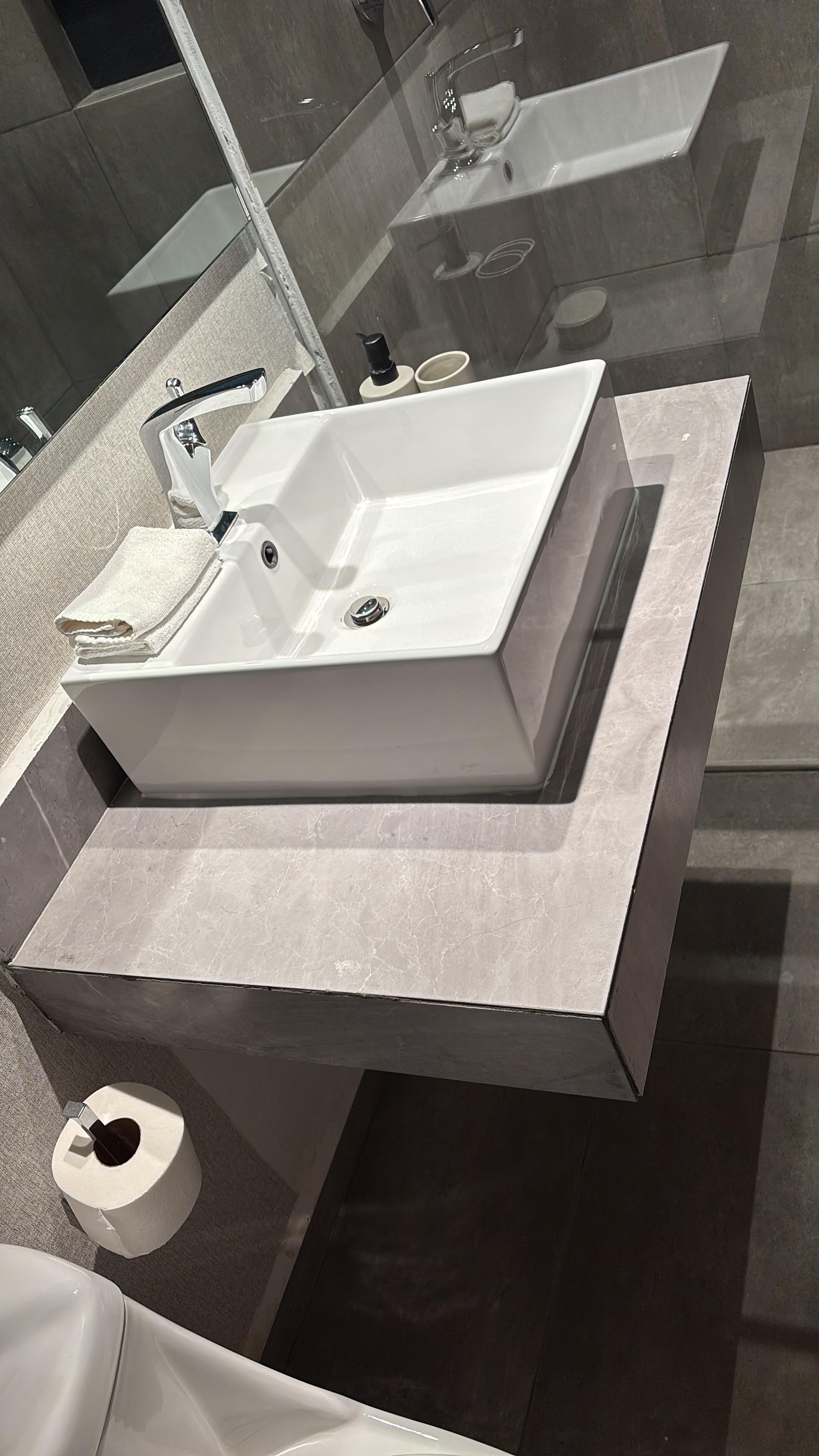 Nicely done bathroom but think the door was put on the wrong side. When you open the door, you have to step in the shower, then close the door to get to the toilet.