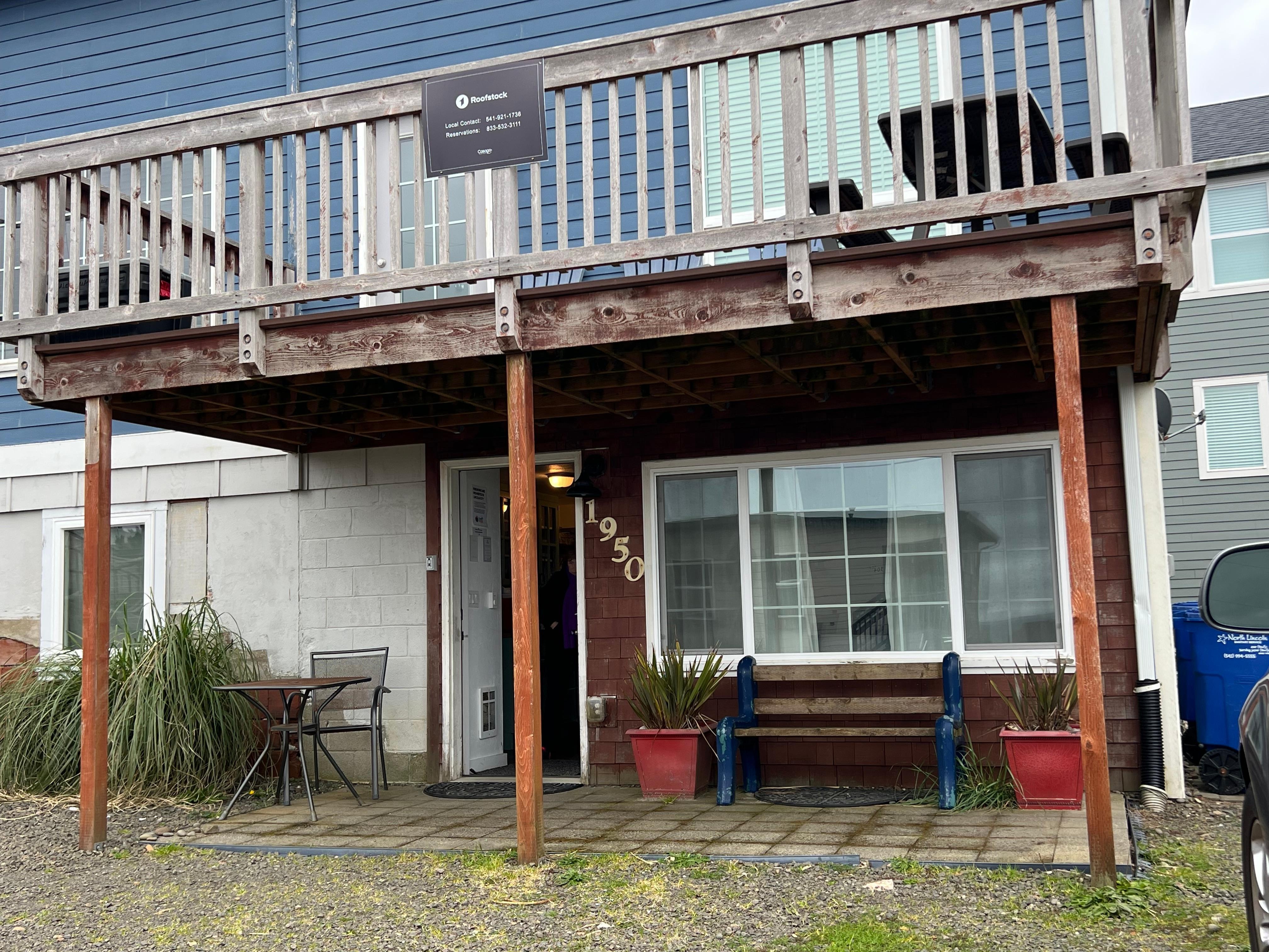 The bottom is the Private Patio.  One bench, one table.  Open facing the street and the parked cars