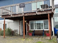 The bottom is the Private Patio. One bench, one table. Open facing the street and the parked cars