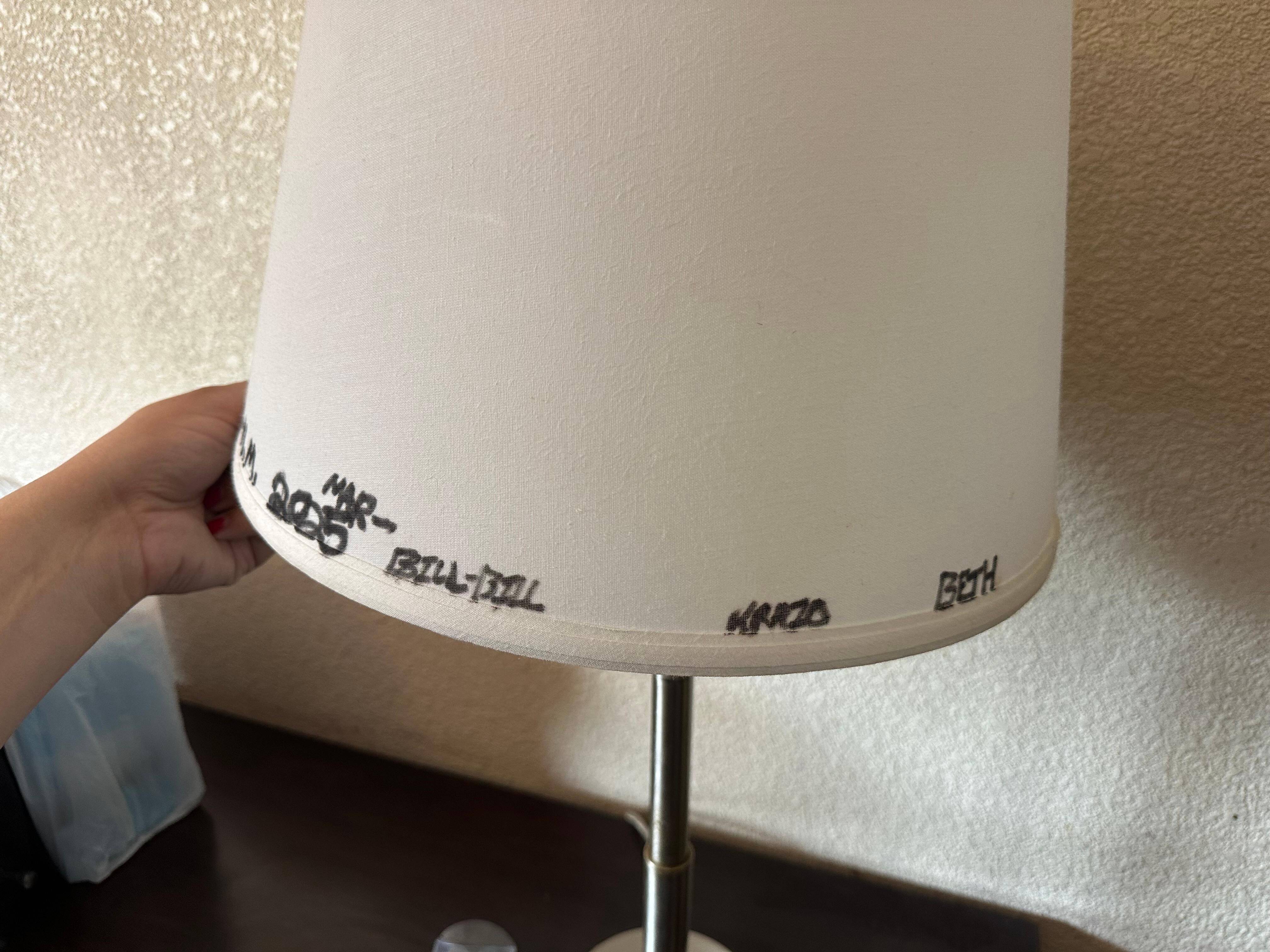 Writing on the lamp shade in marker
