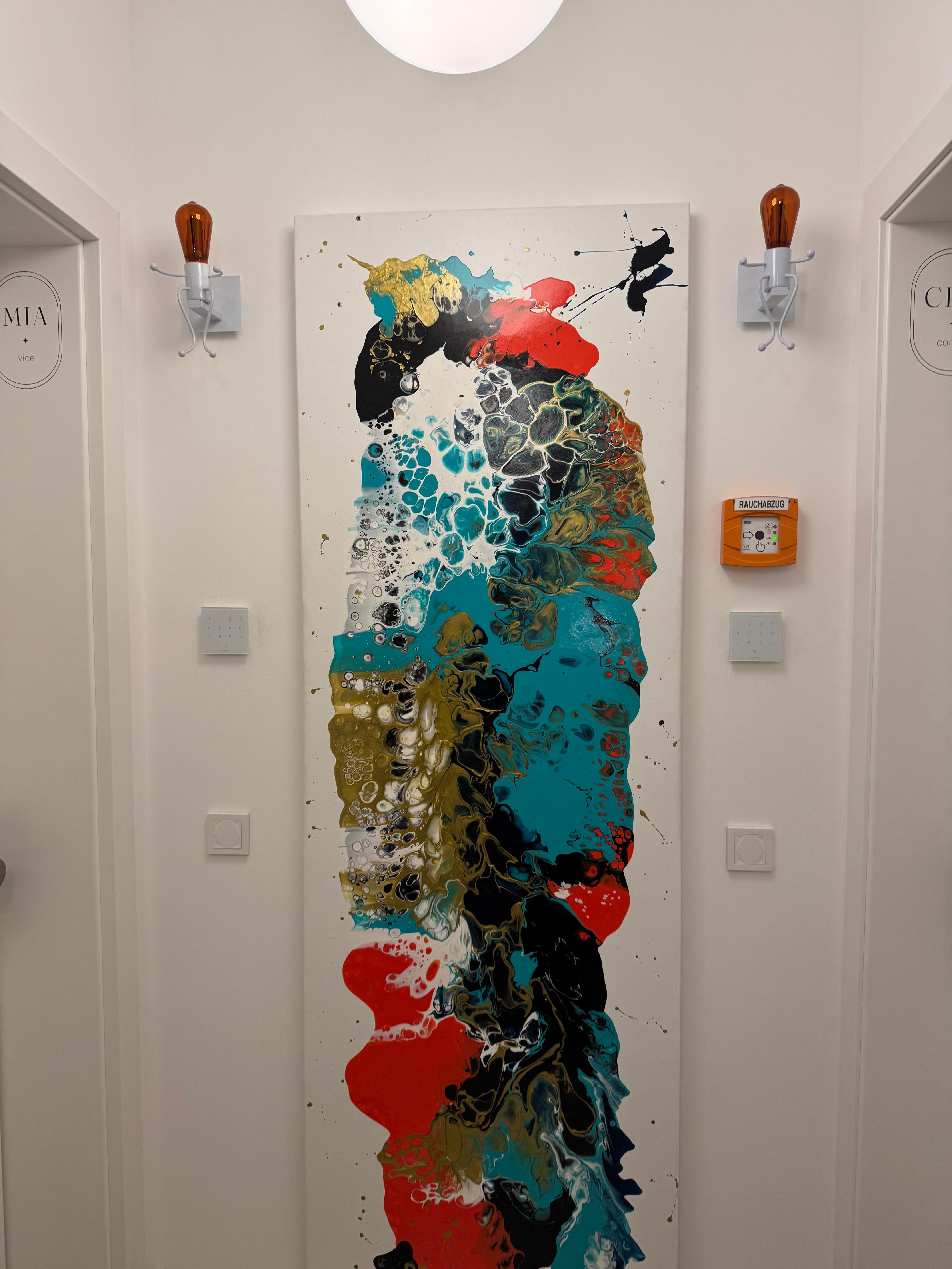 Art in the hallway with super cool light fixtures 