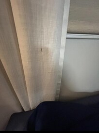 random brown stains on the curtains