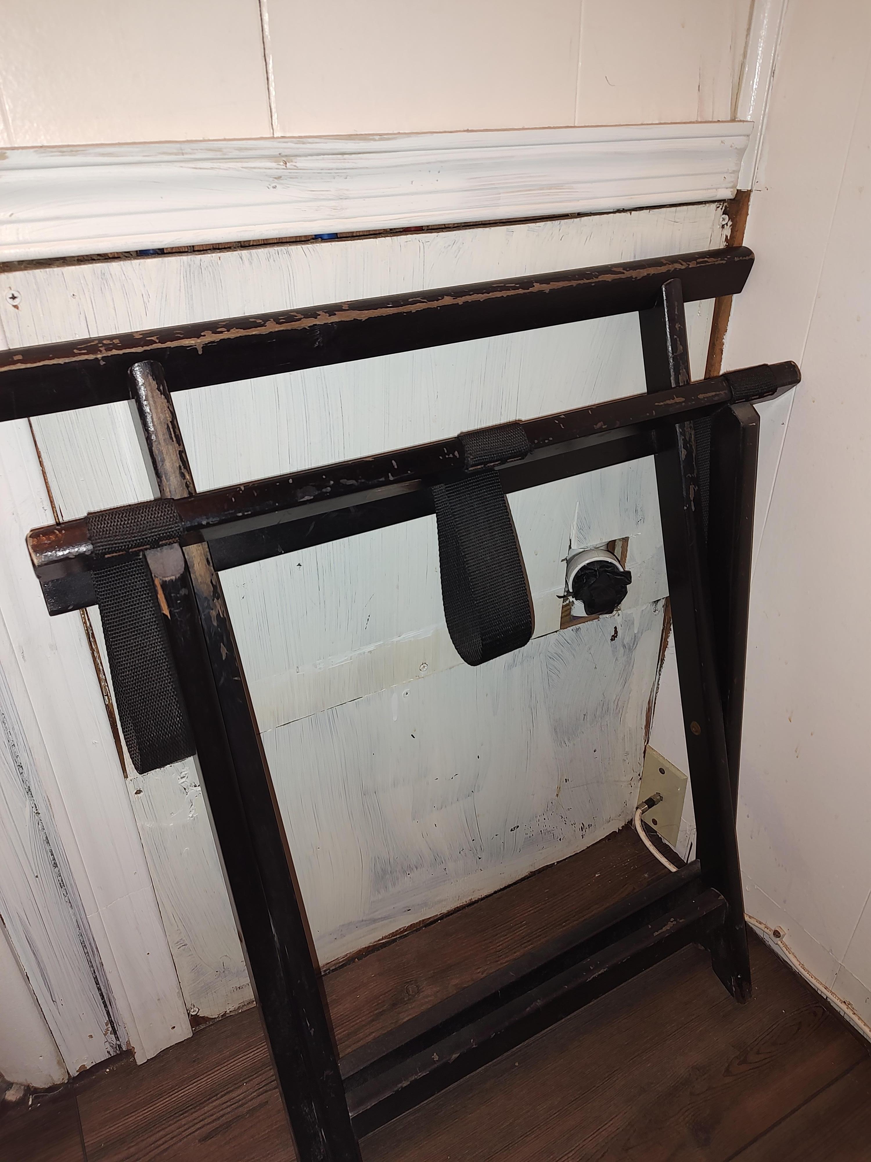 Pipe sticking out of the wall behind tub