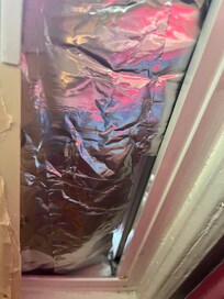 This AC unit he brought upstairs days later and installed and covered the opening with allium foil.