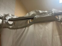 Shower curtain ripped, falling apart