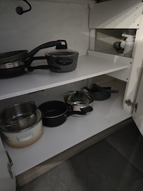 The dustpan and hand broom were next to the pots and pans, very non-hygienic!