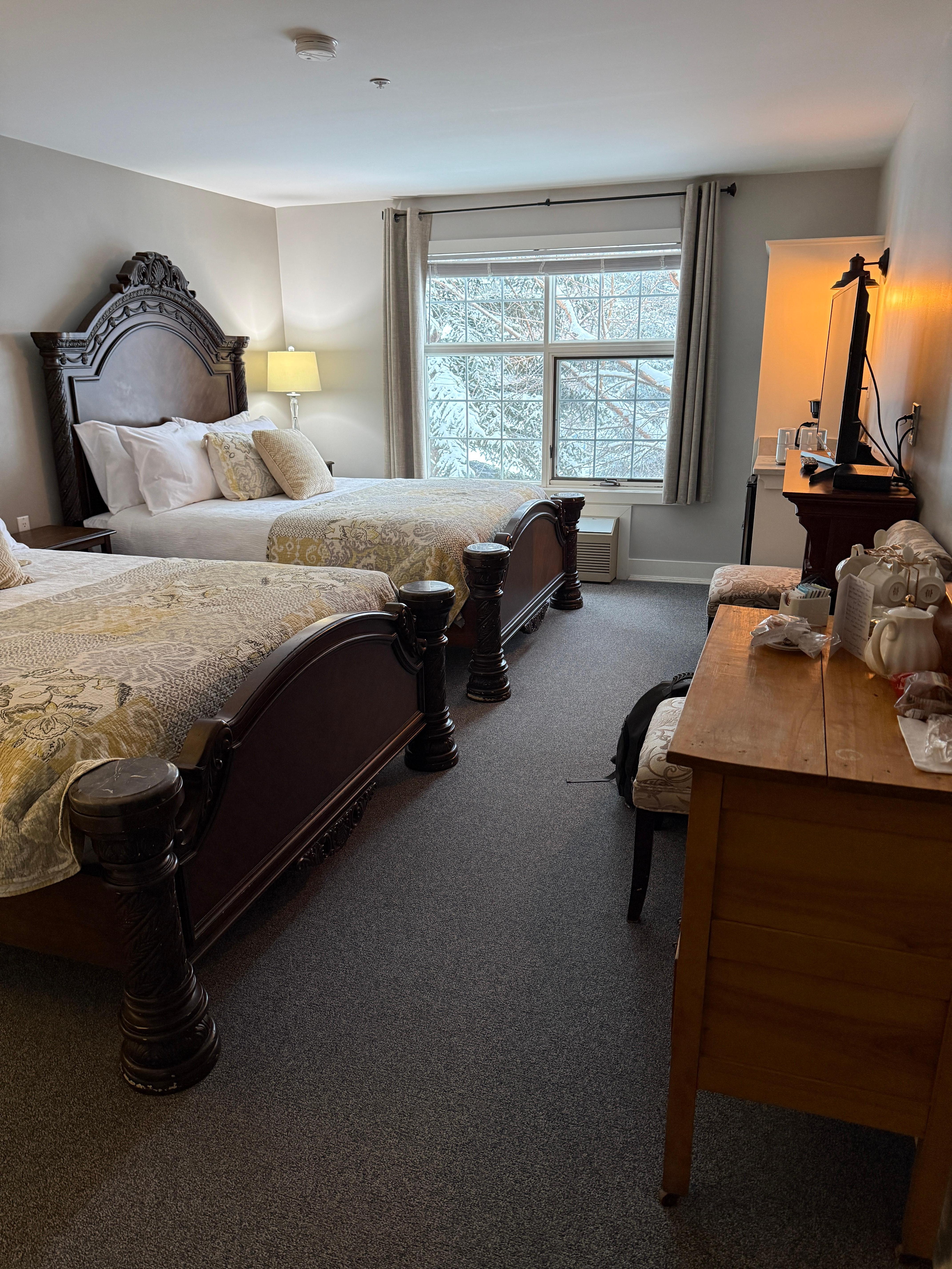 The queen room with electric fireplace and comfy beds 