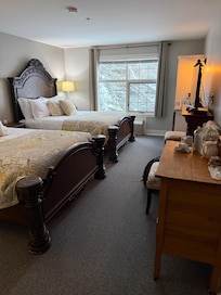 The queen room with electric fireplace and comfy beds