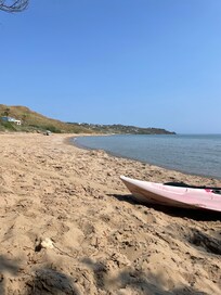 Calm beach with a stable boat for use. Even when the waves got high it was good for surfing!