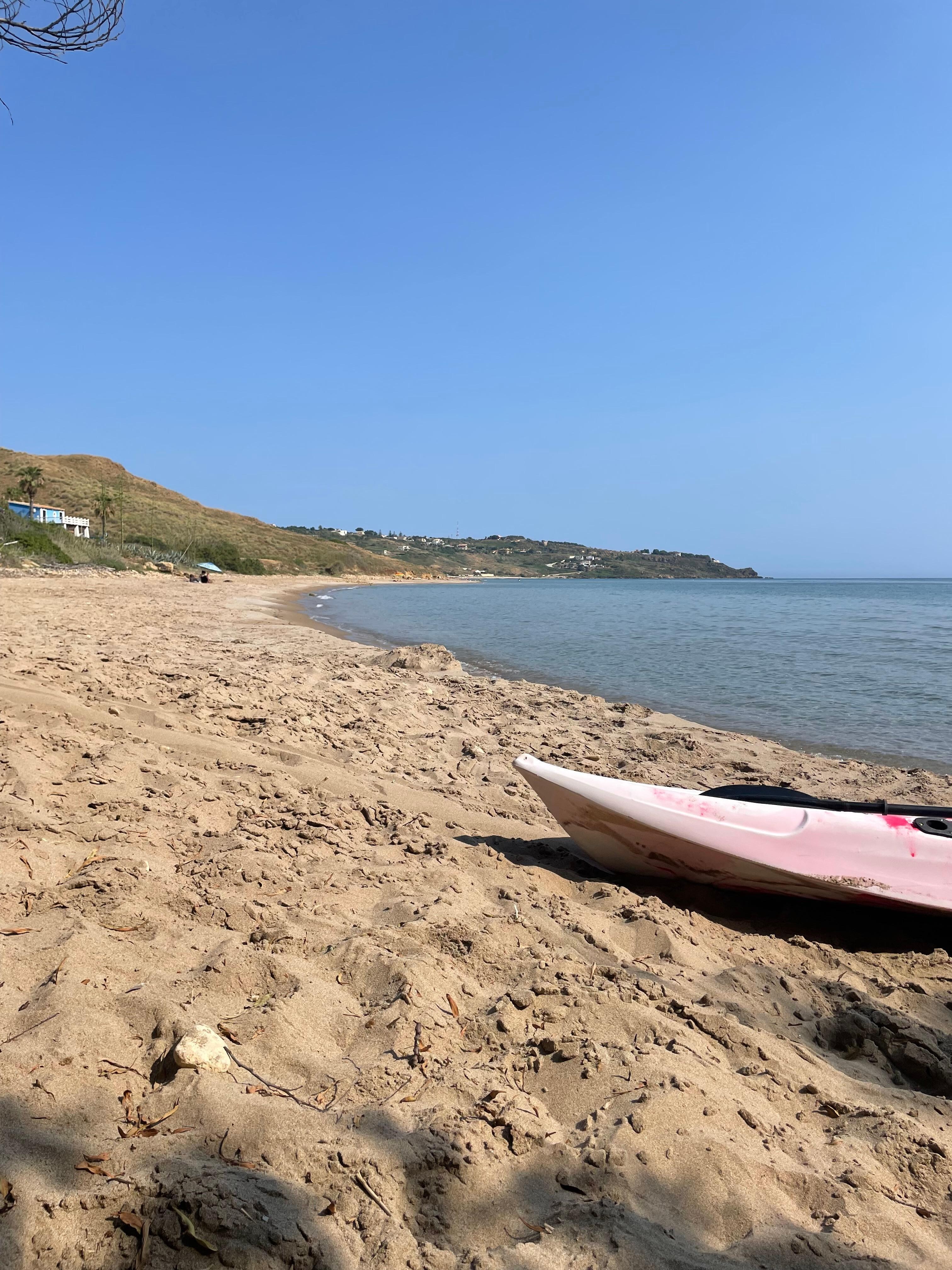 Calm beach with a stable boat for use. Even when the waves got high it was good for surfing!