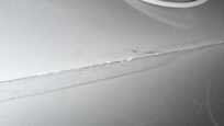 Rough marble top corner joint.