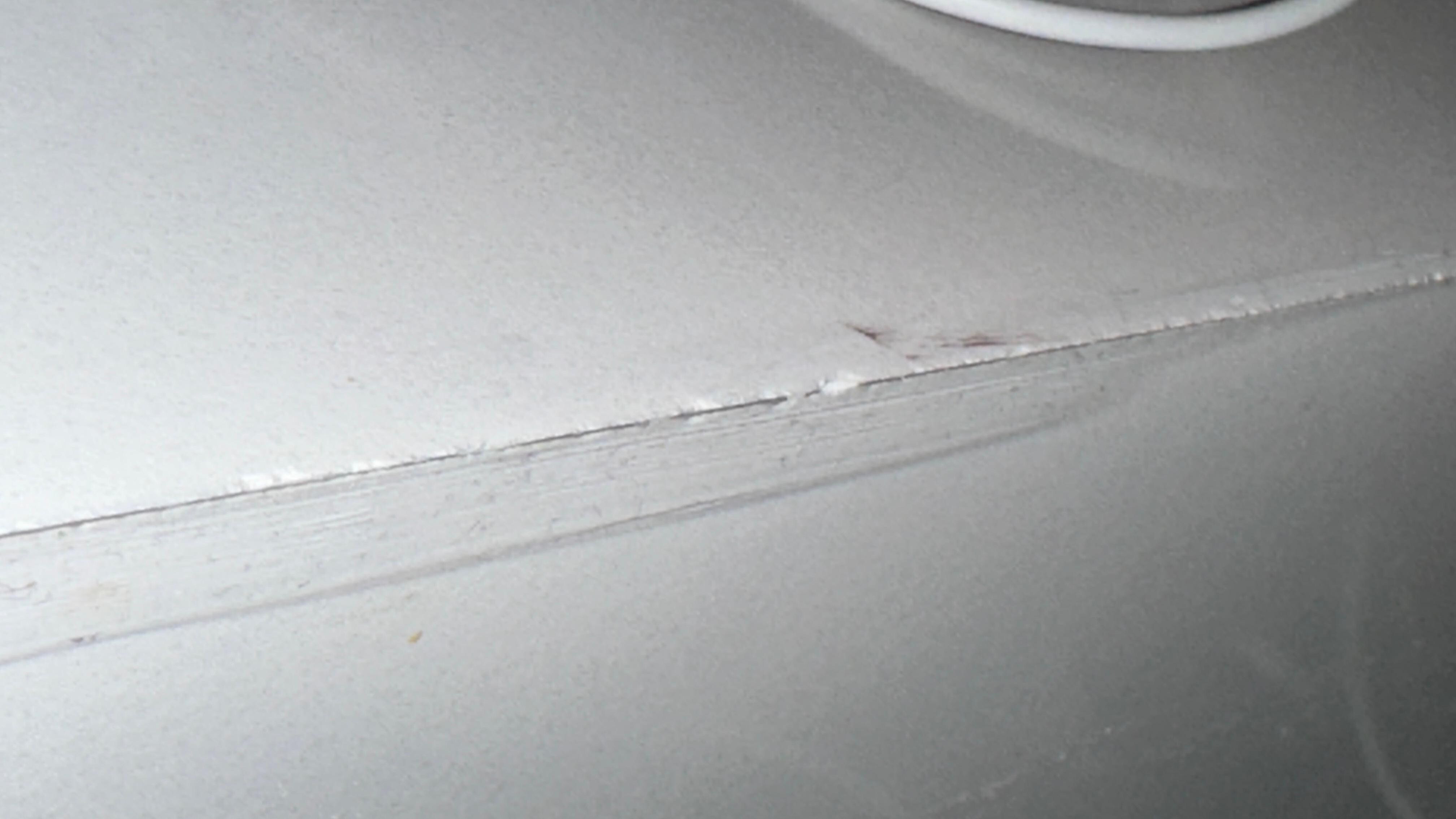 Rough marble top corner joint.