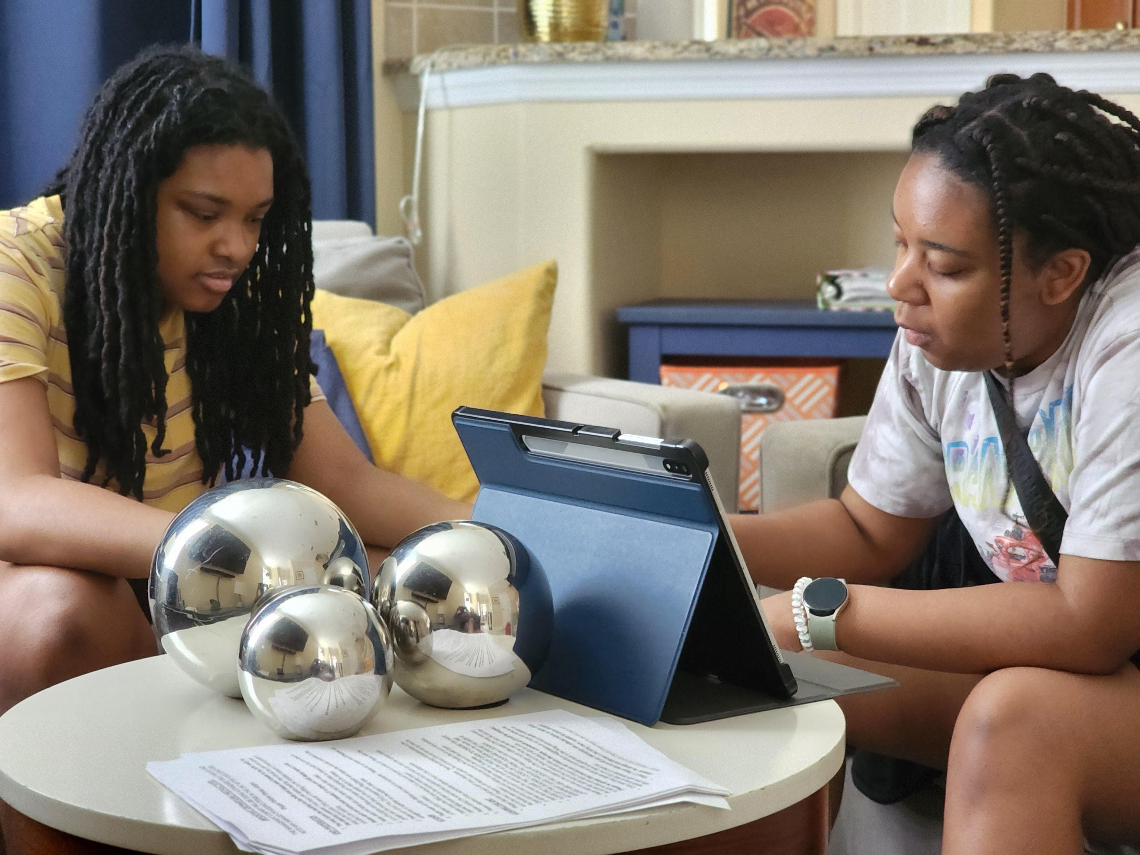 Cousins playing trouble in the living room.