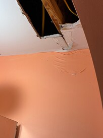 A hole the the bathroom ceiling