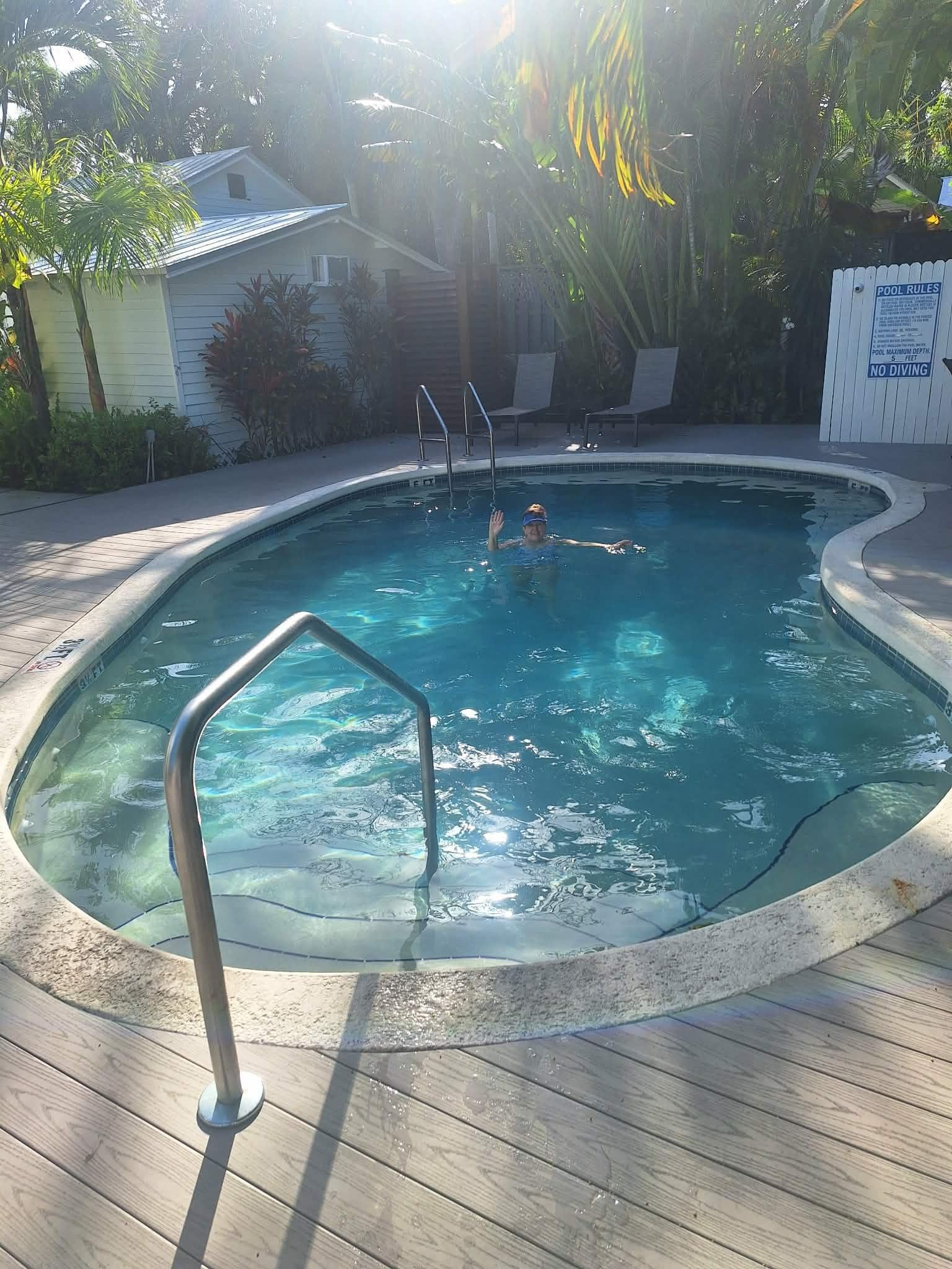 Enjoying a swim in the heated pool after coffee and juice served in the gardens. It's a good life!