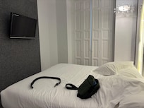 Bed, excuse my bag and belt