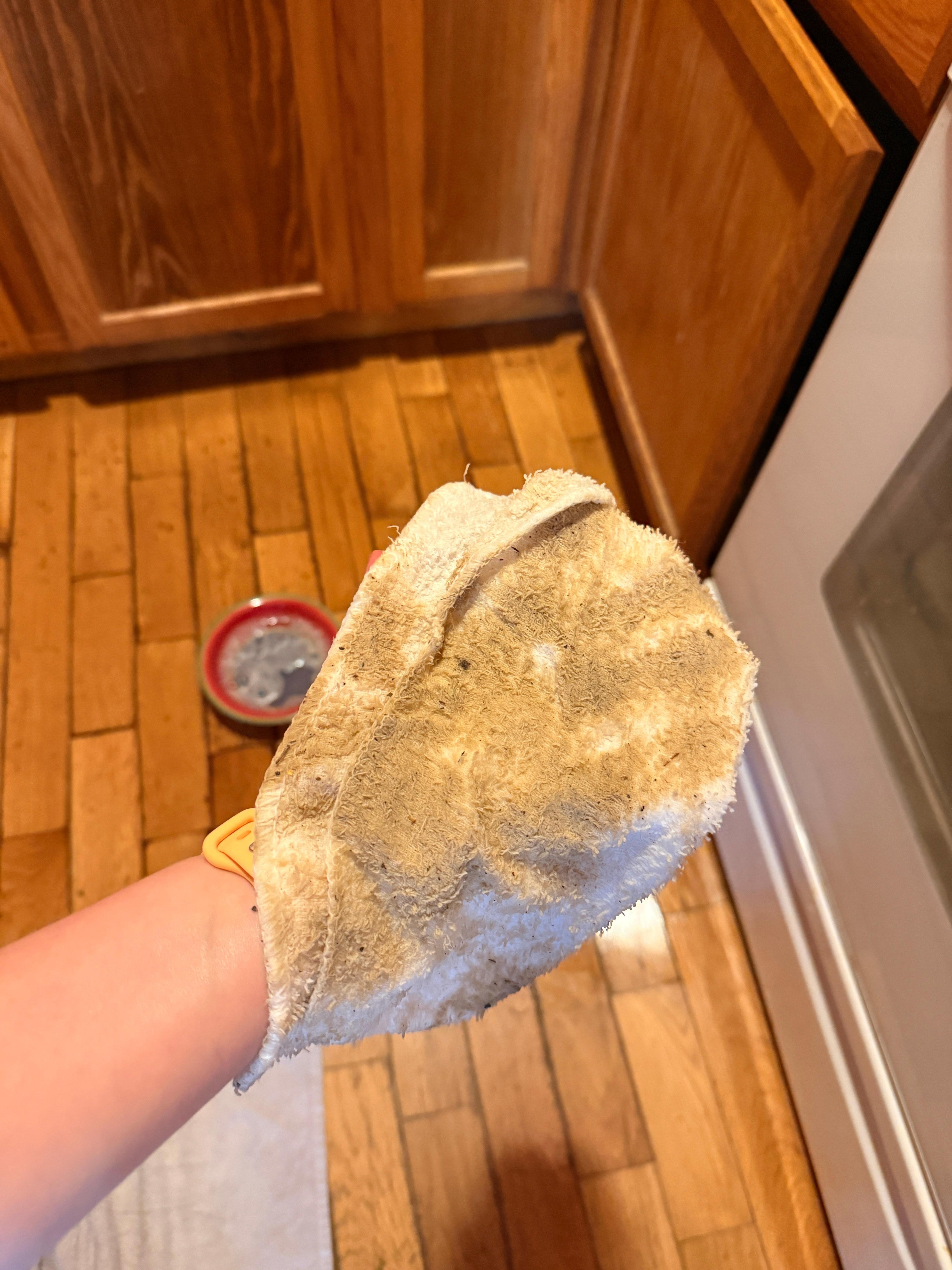 After sweeping then scrubbing just the area by the sink on my hand and knees.