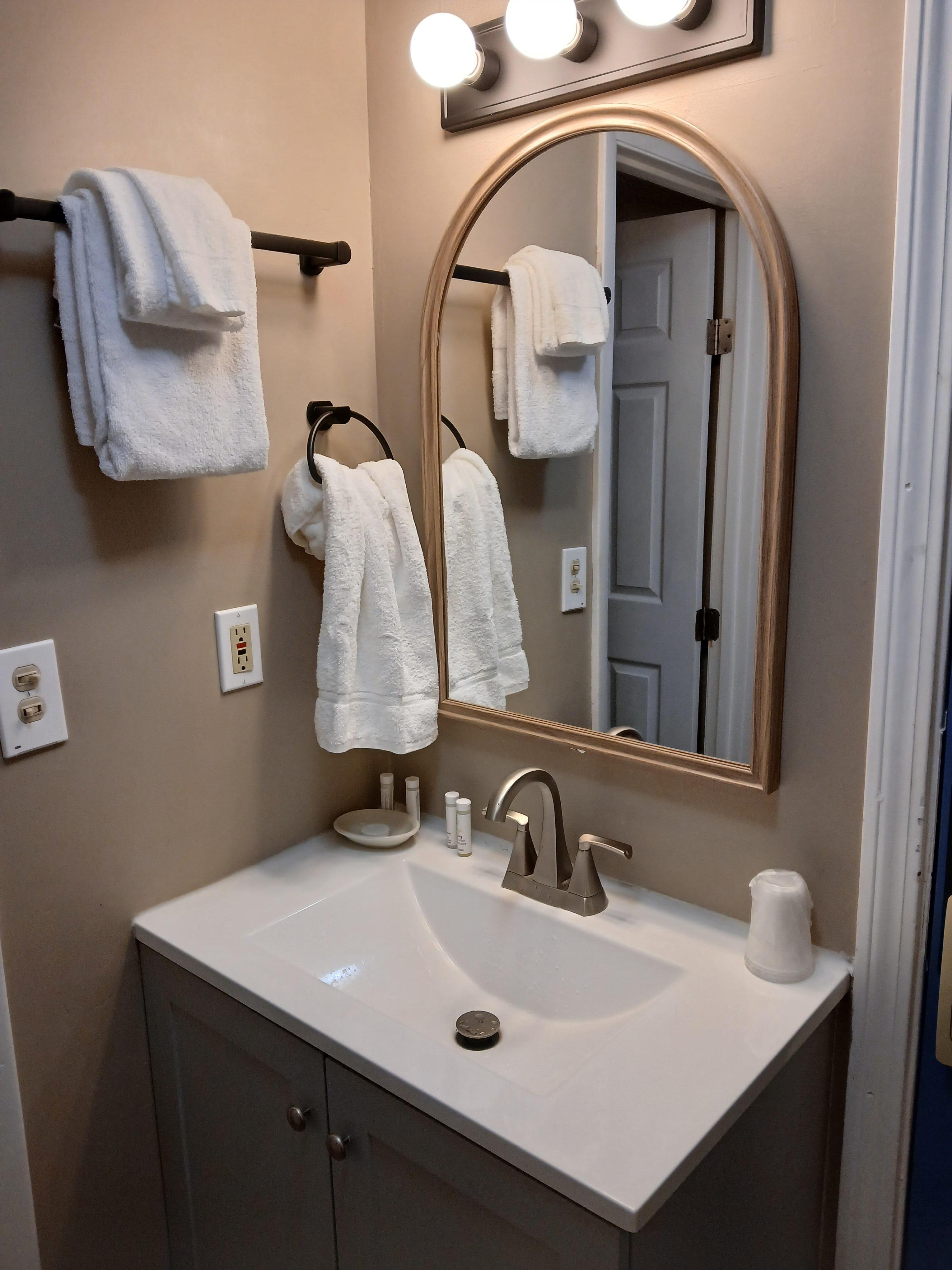 Sink is outside the bathroom.