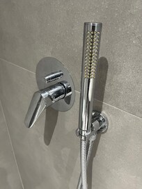 You can see the way that the shower head is facing outwards is how I met it so when I turned the tap, I expected the rainfall showerhead would fall down I didn’t even realise that the showerhead was facing me and a strong jet of water would shoot out