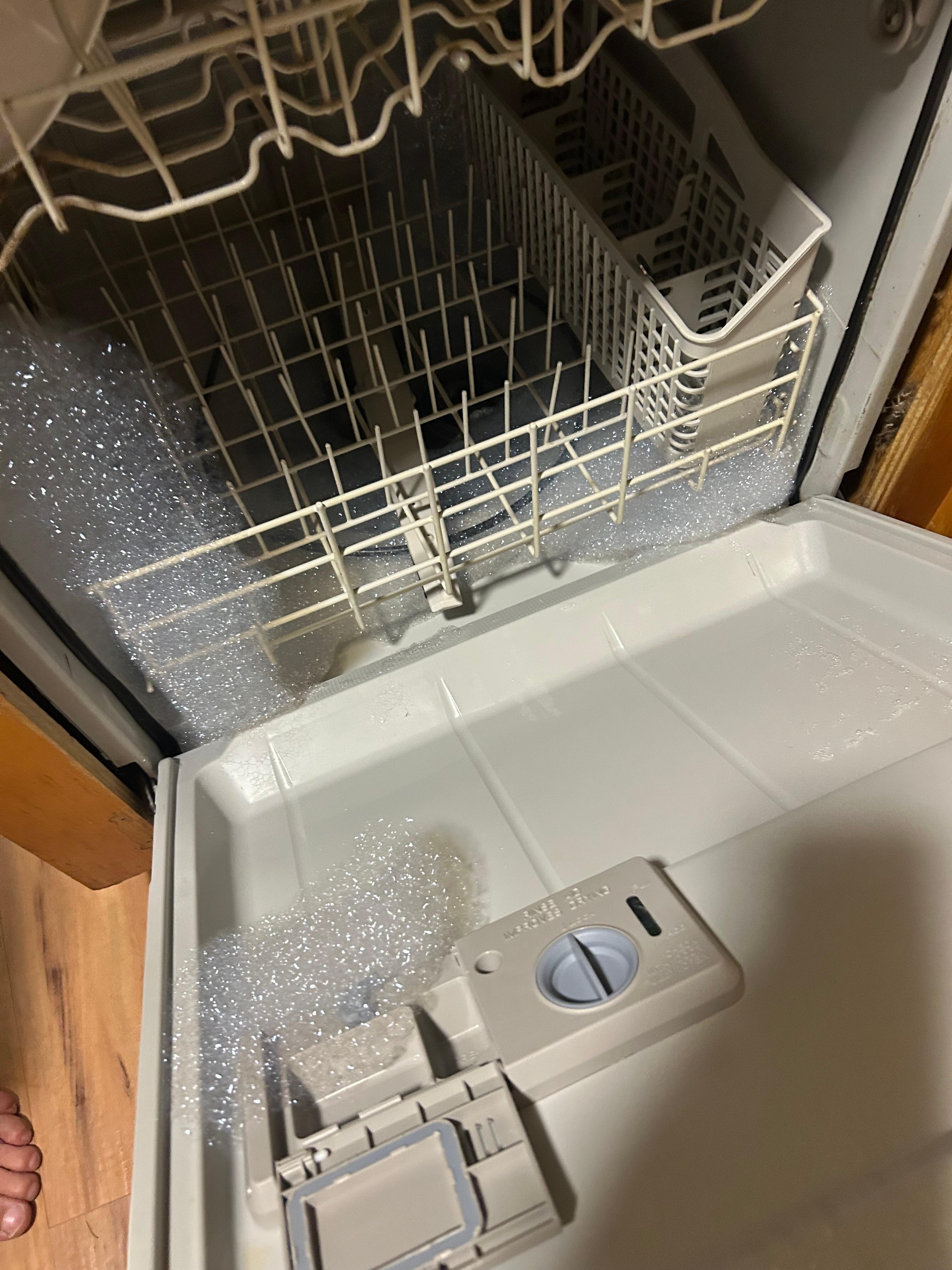 Dishwasher full of foam that overflowed onto the floor 