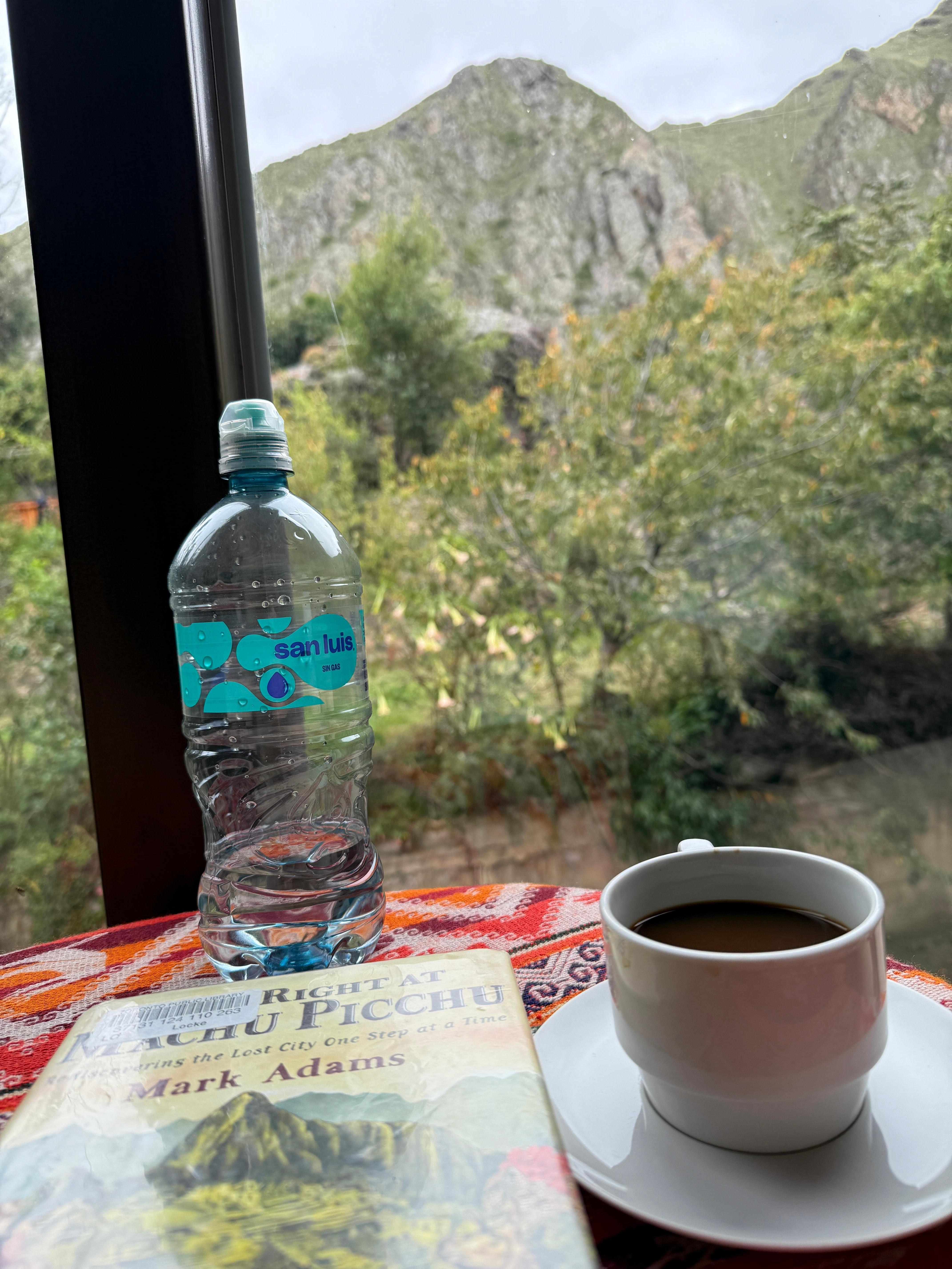 Coffee and book in the lounge overlooking the river and mountain