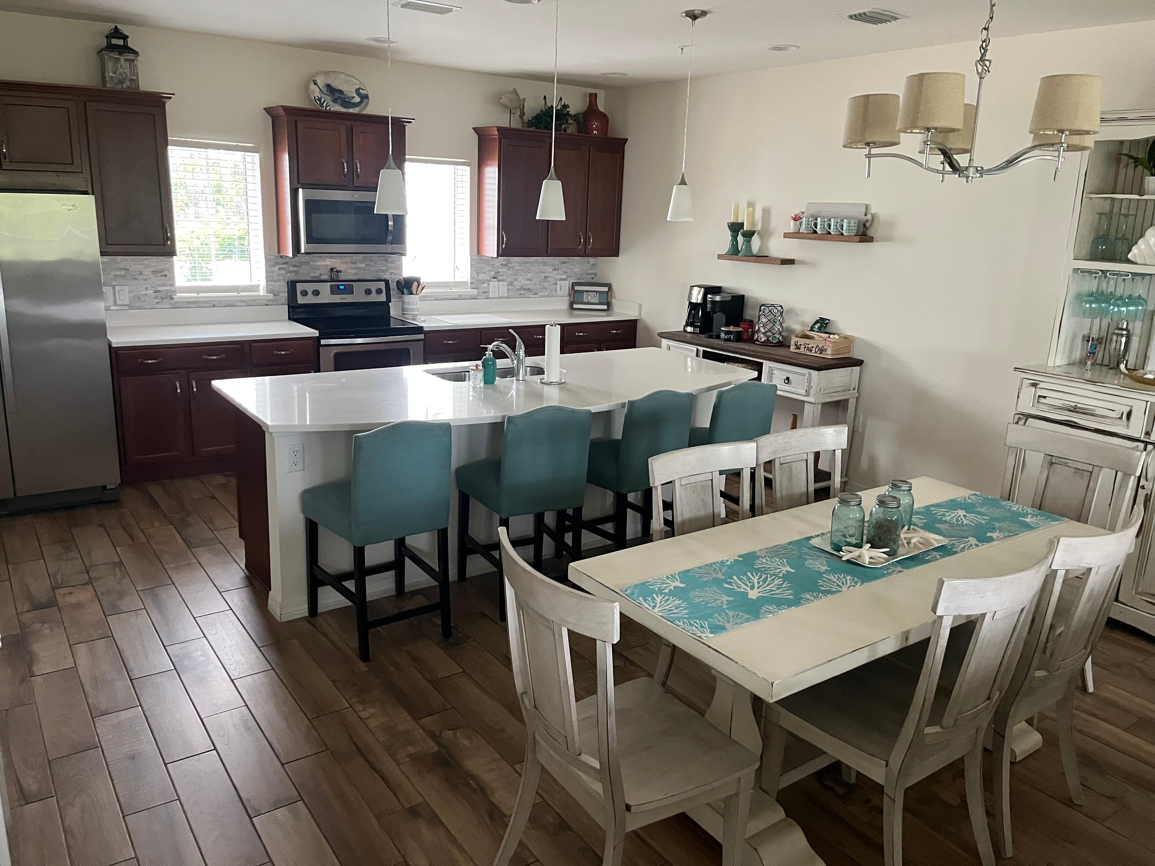 Open, spotless, well-appointed kitchen 