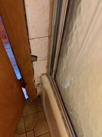 broken tiles & mold in bathroom-only 6 inches between tub and edge of toilet - not safe