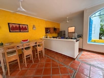 Shared kitchen area with fridge and stove