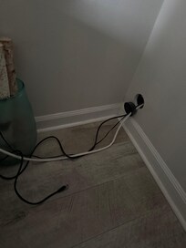 Cords hanging out of the wall