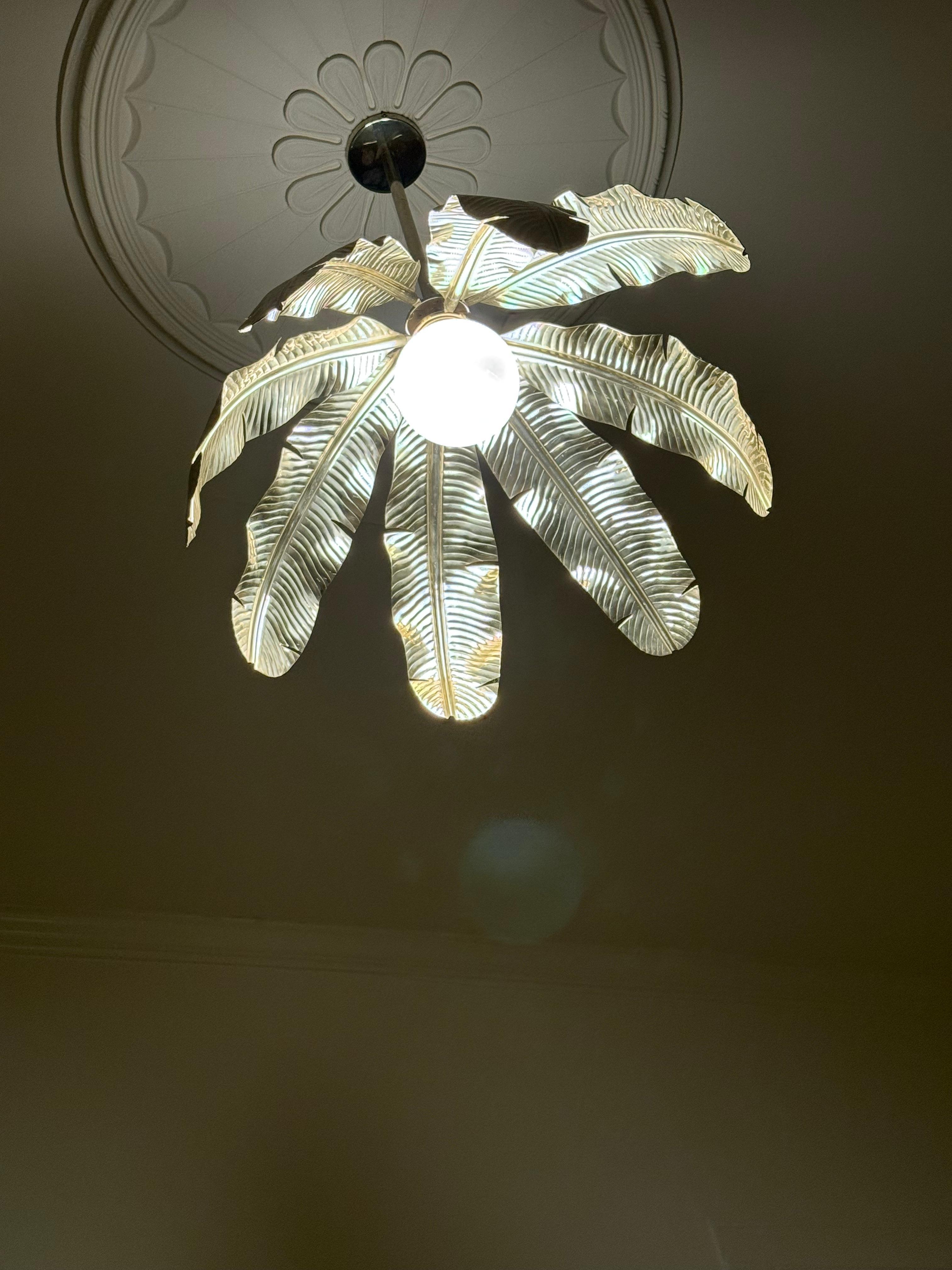 Cool light fixture over bed in Room 1